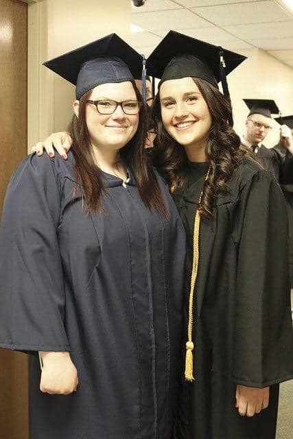 two female grads