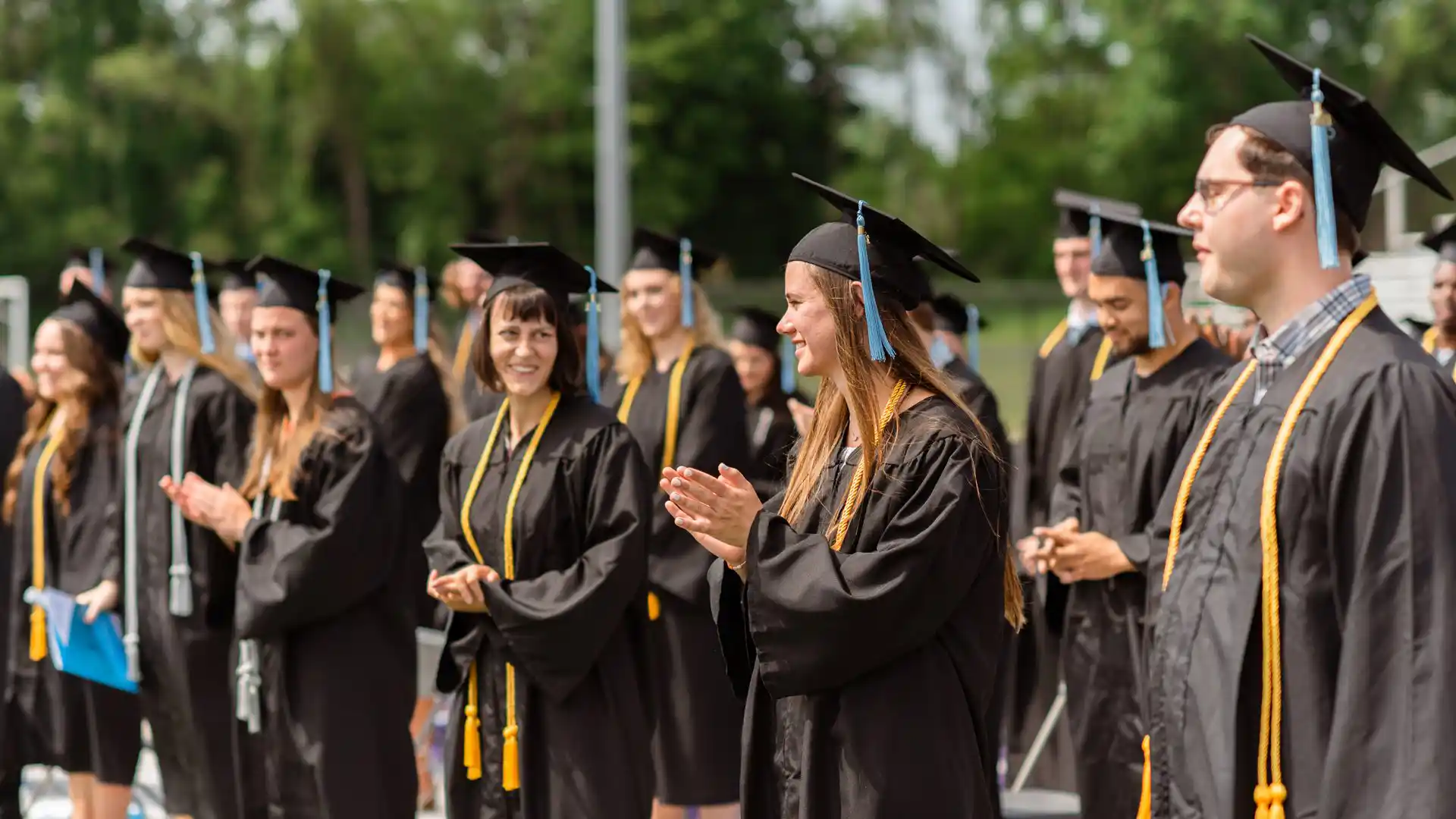 students in caps and gowns