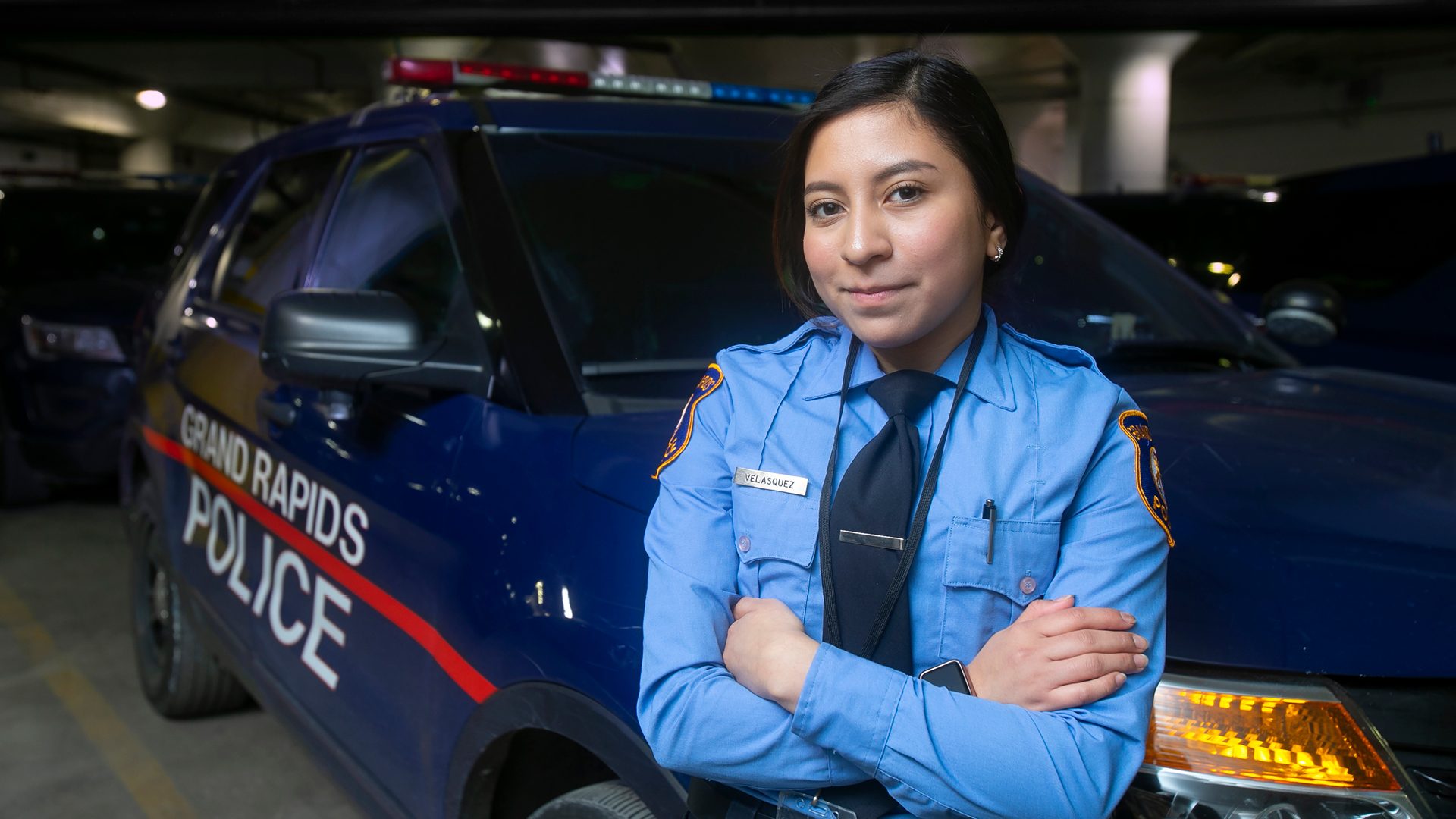 police officer in front of cruiser