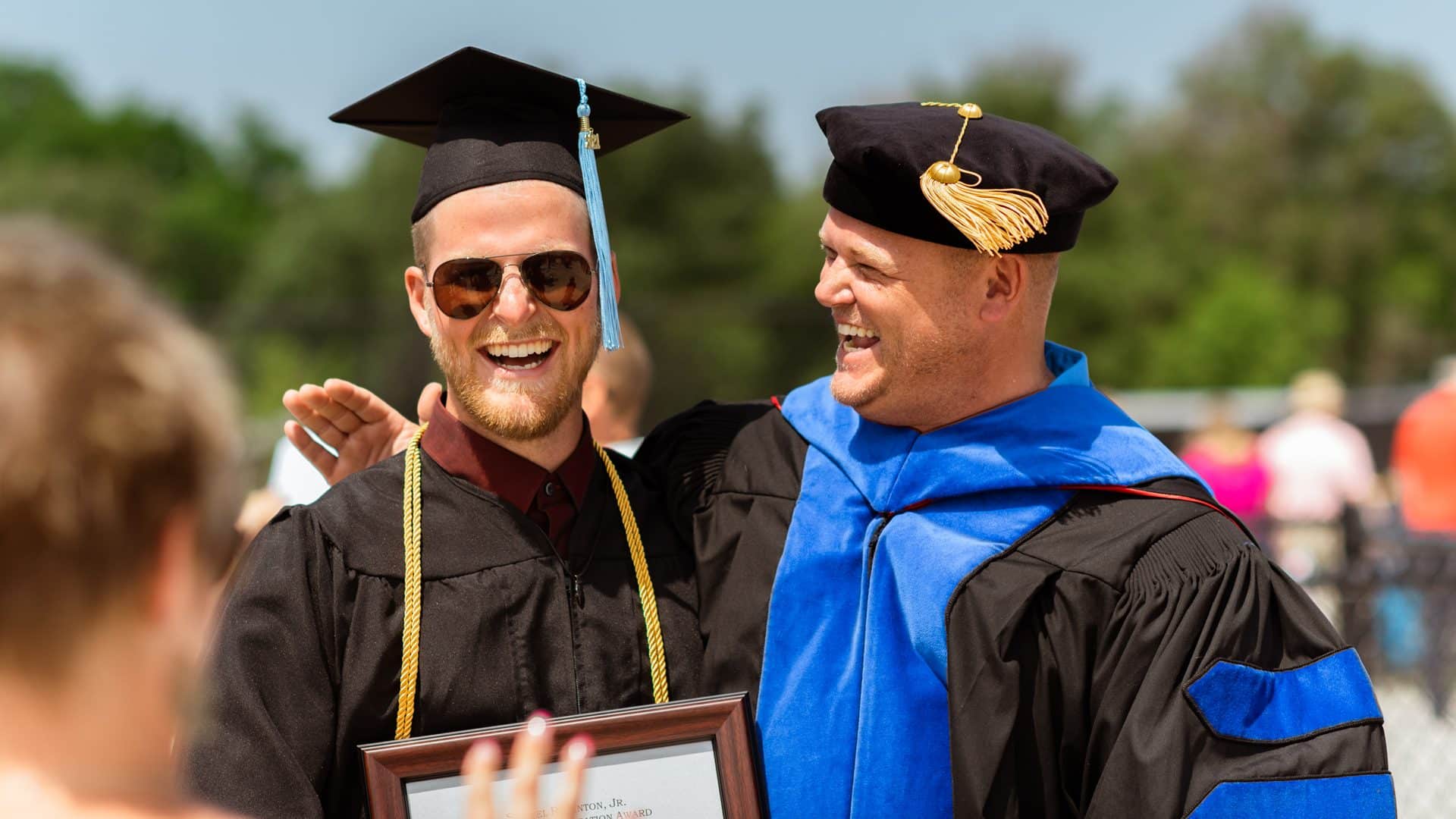 student receiving award at graduation