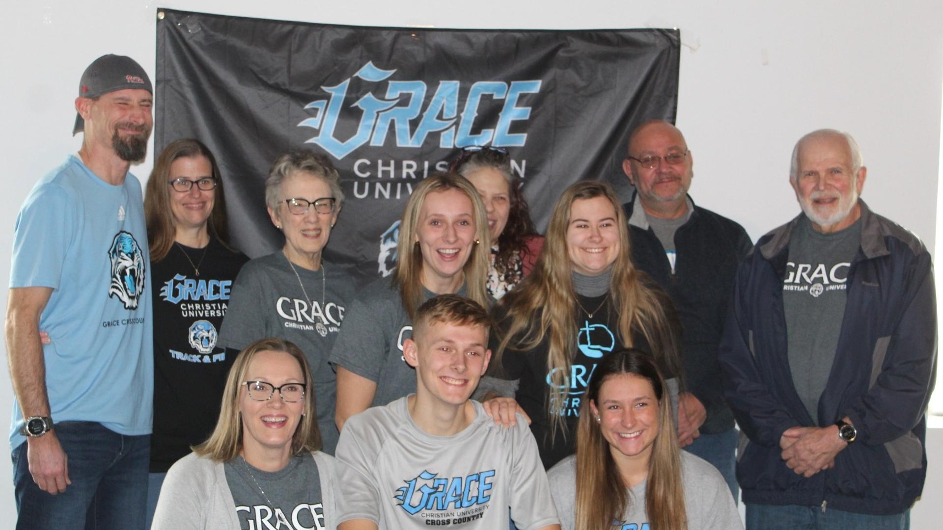people in front of Grace banner