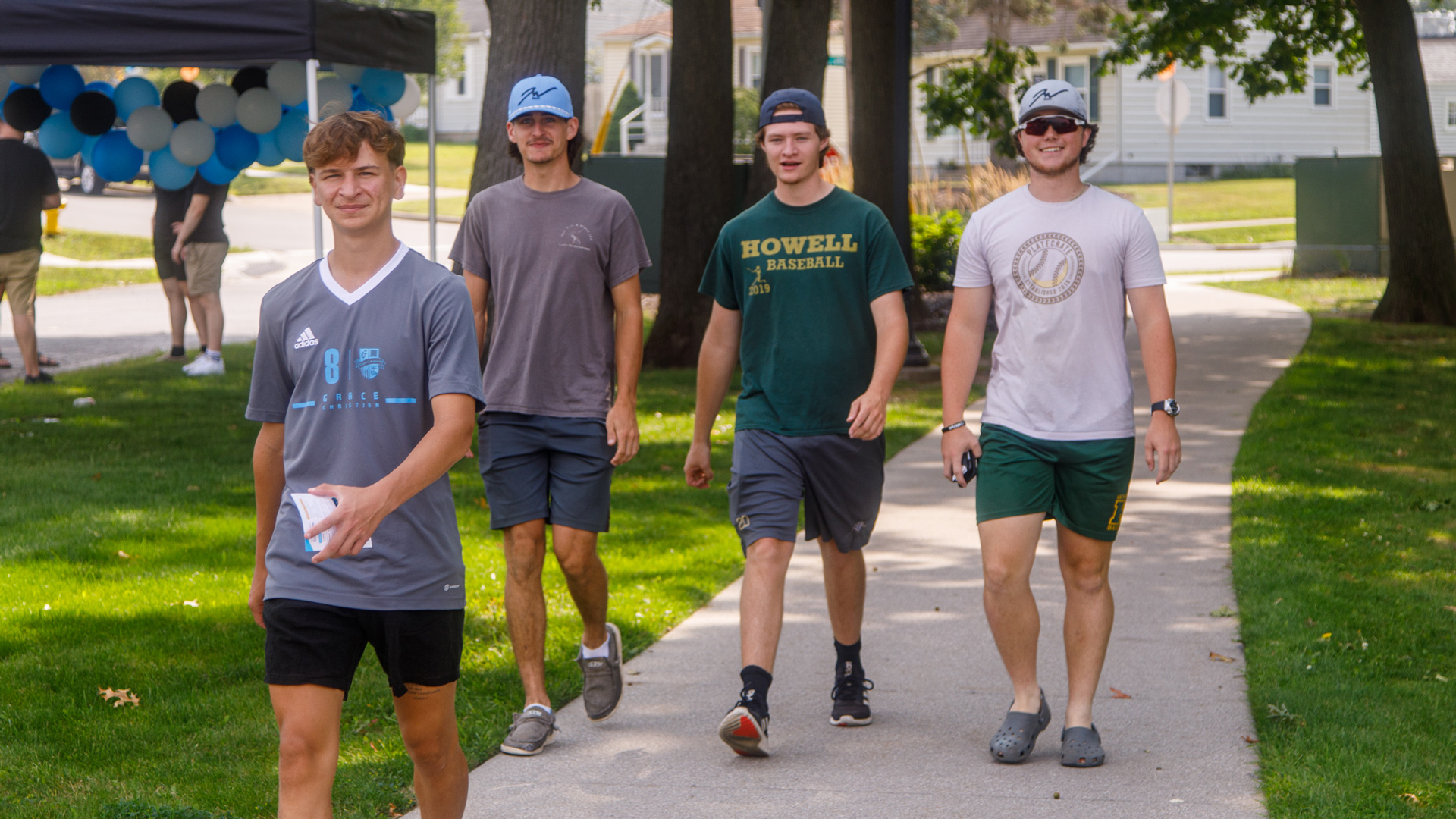 A group of students walking around campus
