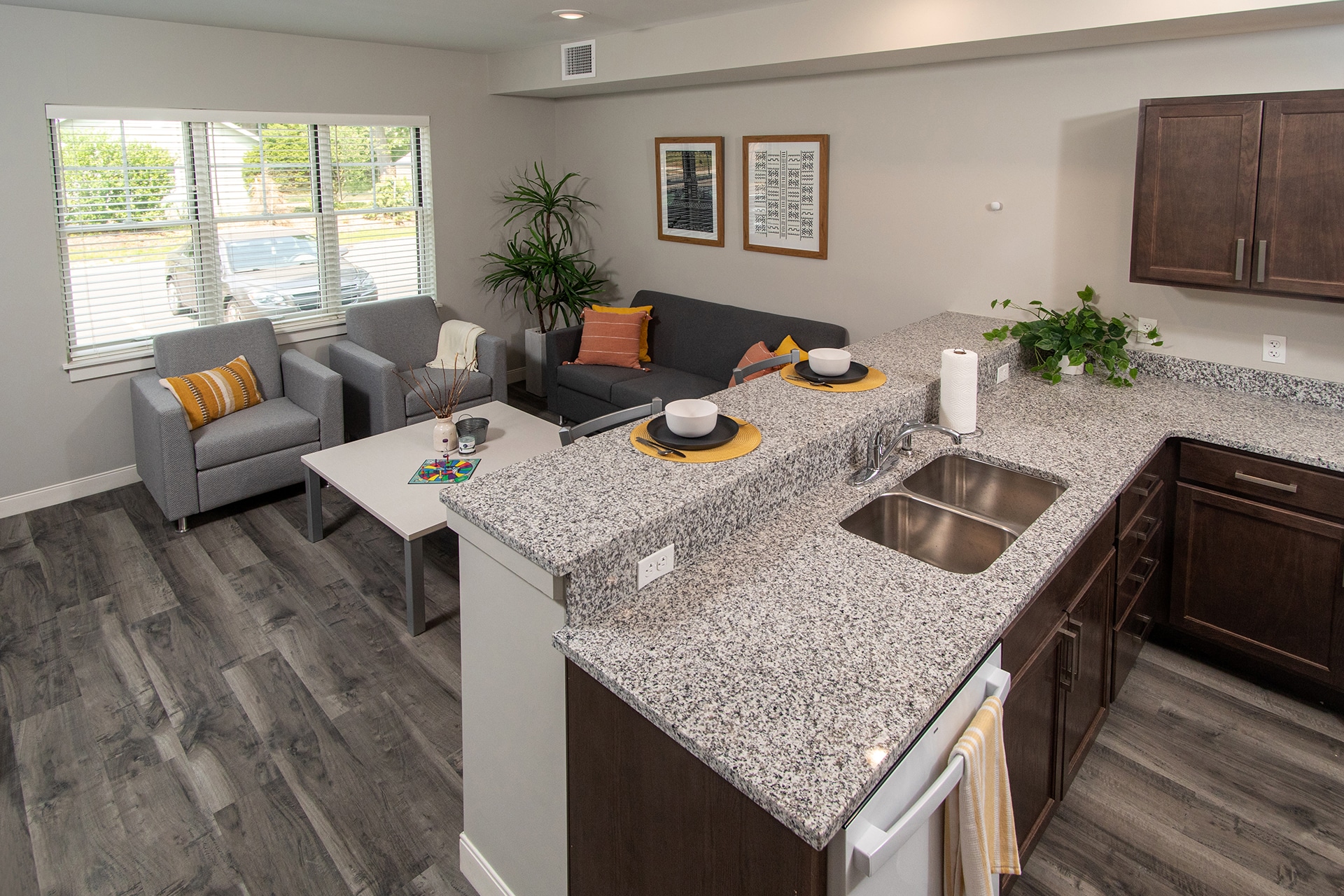 Interior view of a kitchen and living room in one of the Grace Townhomes