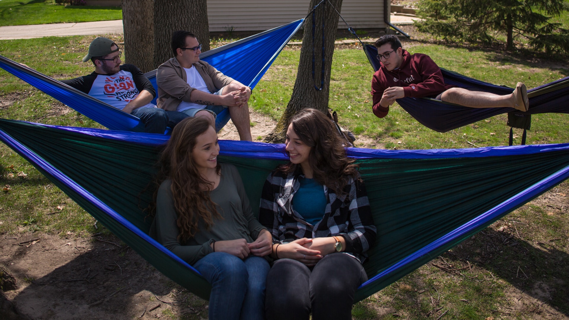 Grace students in hammocks on campus