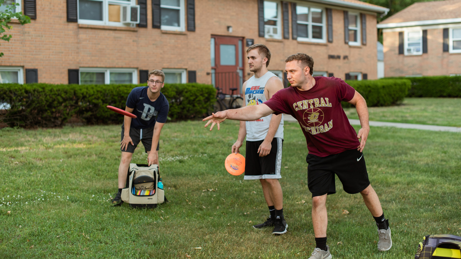 A group of students playing on the Grace Christian University Disc Golf Course.
