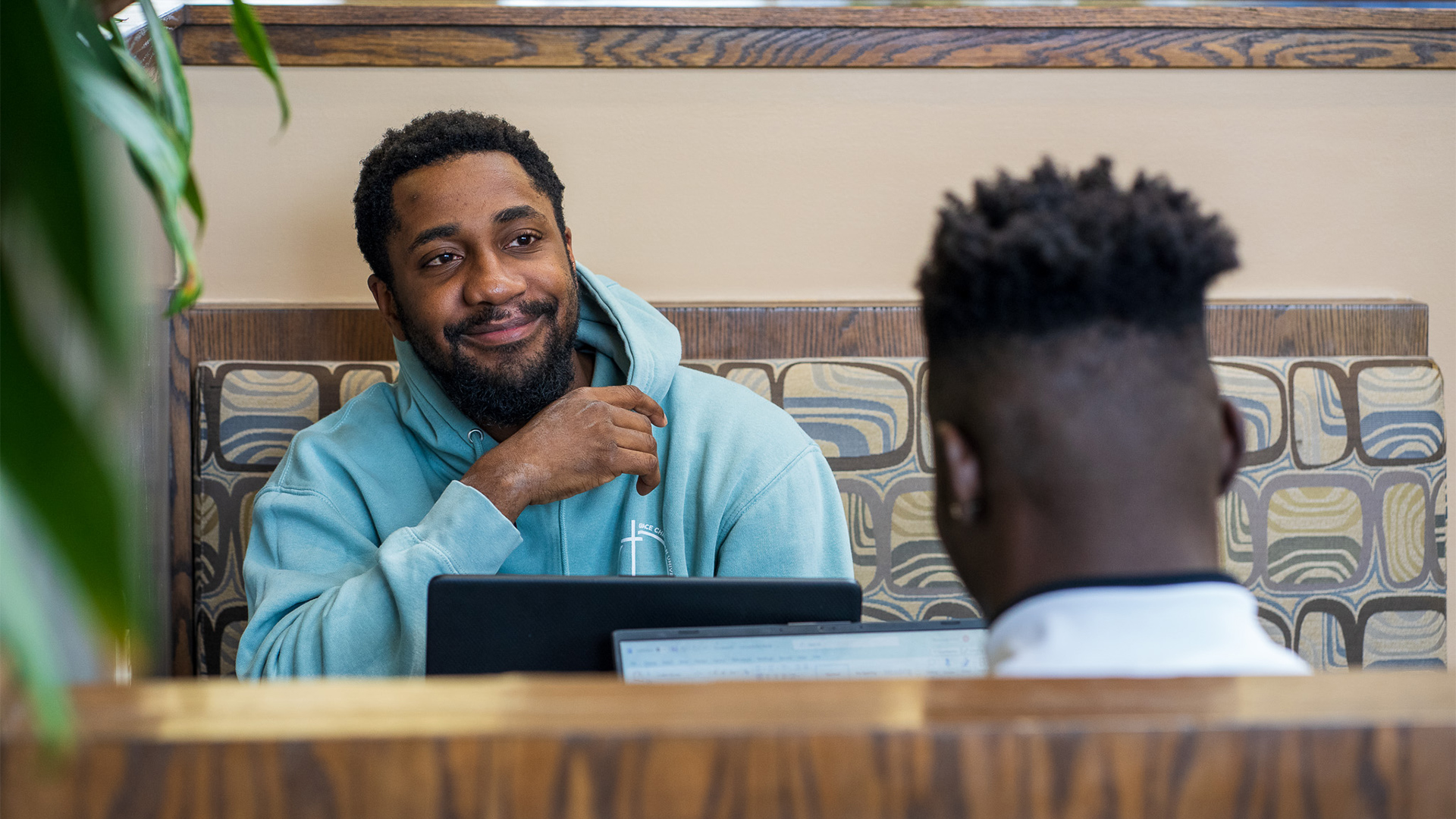 Grace students studying in a booth in the Commons