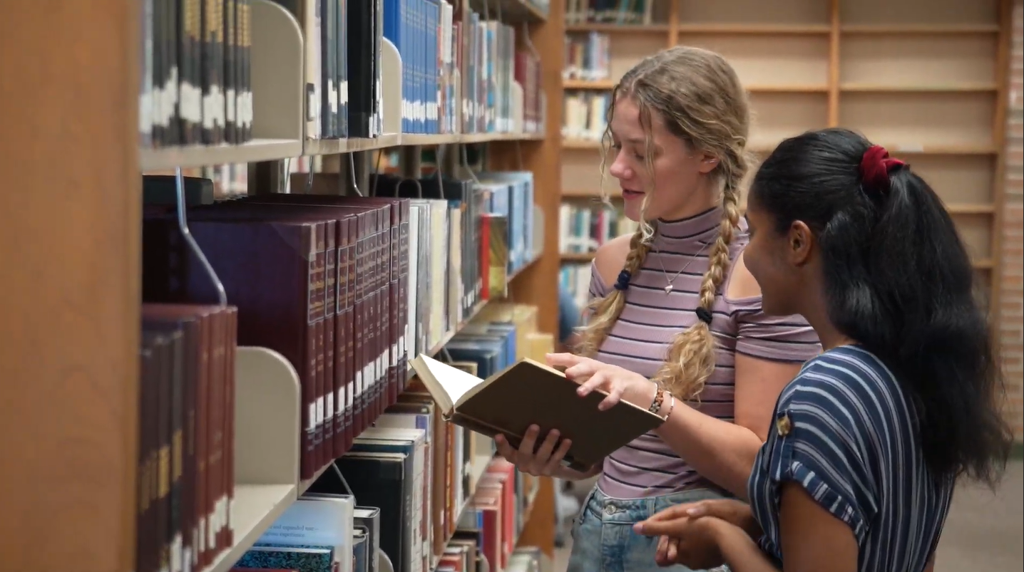 Students-Looking-At-Books