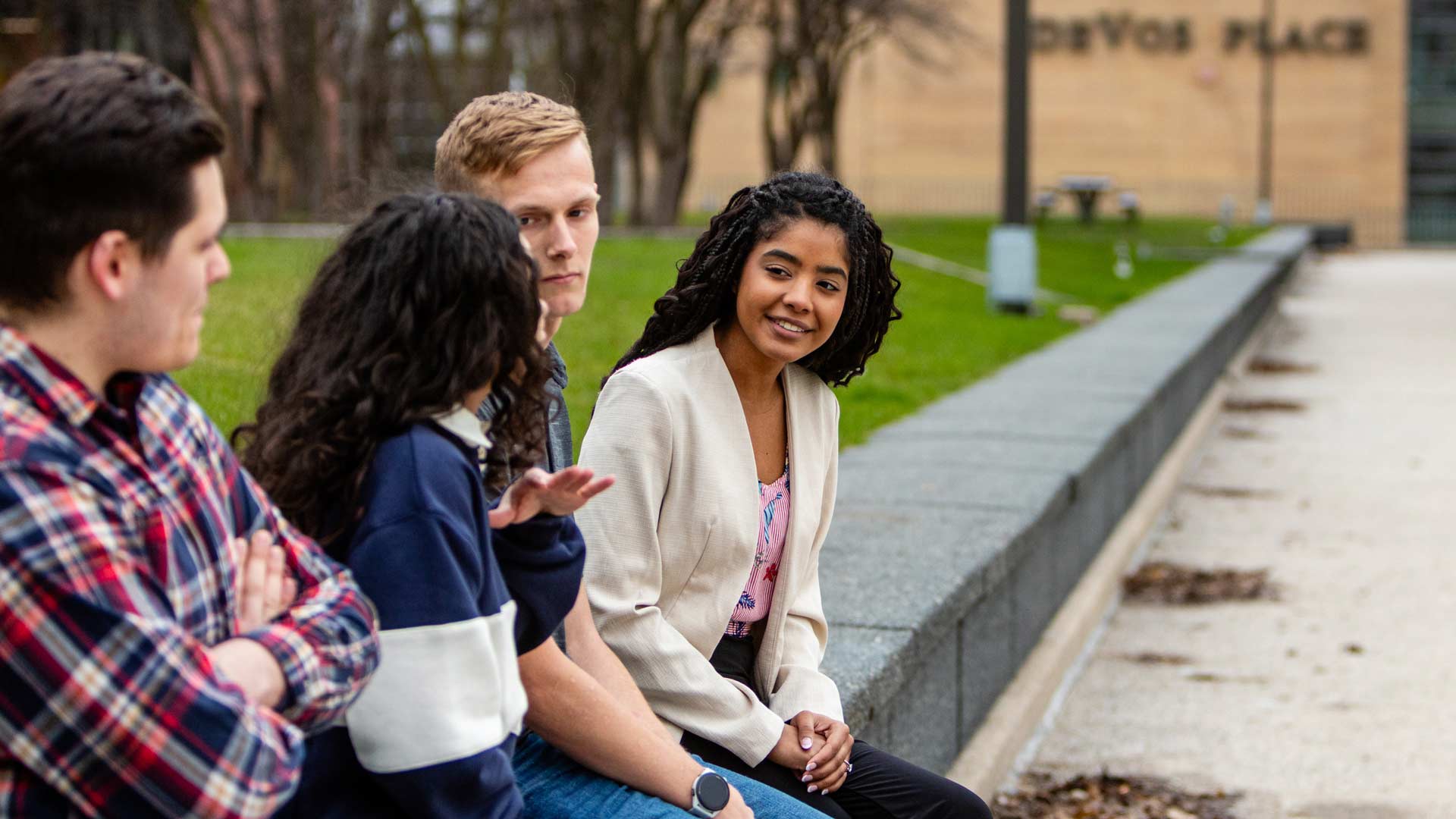 A group of Grace On-Campus students sitting outside in Grand Rapids, Michigan
