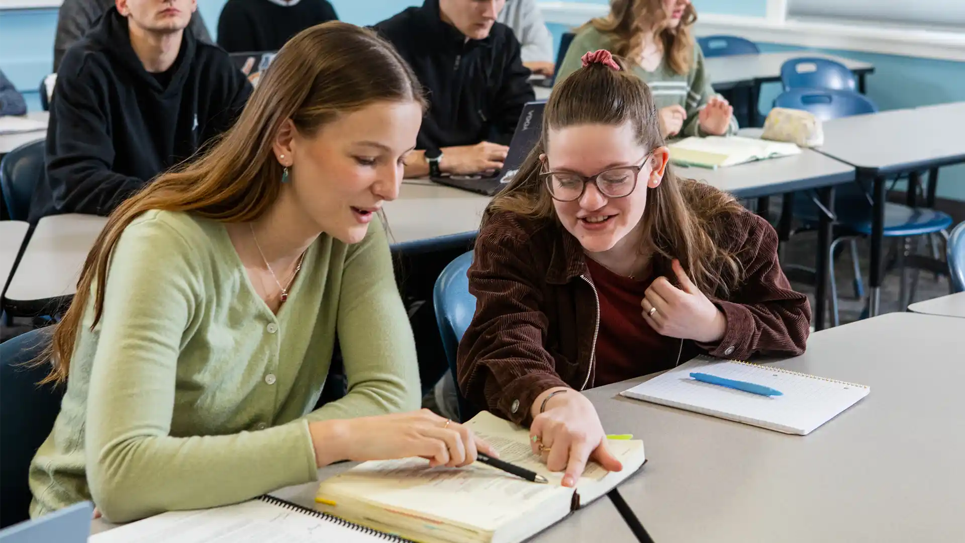 On-Campus students in a classroom studying the Bible